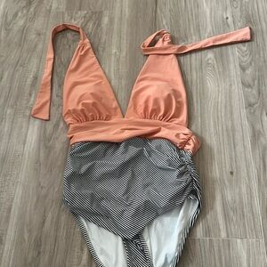 One piece bathing suit with plunging top size large never wore